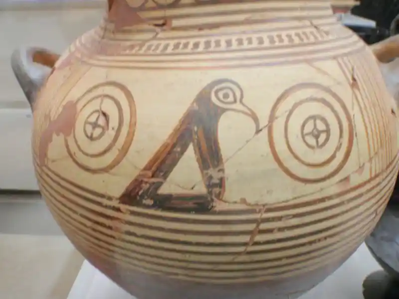 Triangular bird in between two solar crosses